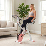 Vélo d'Appartement Pliable 4-en-1 - Ergomètre Magnétique Silencieux avec Cordes de Résistance - Sport Maison et Cardio-training avec Roulettes, Selle Confort et LCD (Max 120kg), Rose