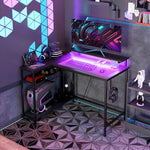 Bureau d'angle réversible, bureau d'ordinateur avec LED, 2 prises et 2 ports USB et panier réglable, 107x80x90cm, noir