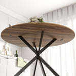 Table à manger ronde pour 4 personnes 120 cm style industriel avec plateau aspect bois, piètement croisé en acier, marron